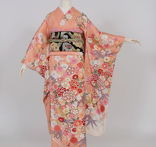 サーモンピンク束ね彩花に四季花の丸